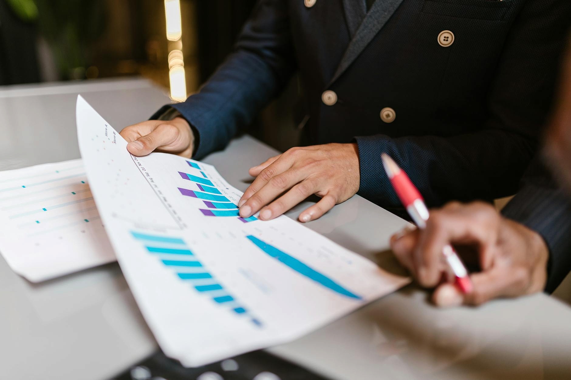 Finance team reviewing digital knowledge base on laptop